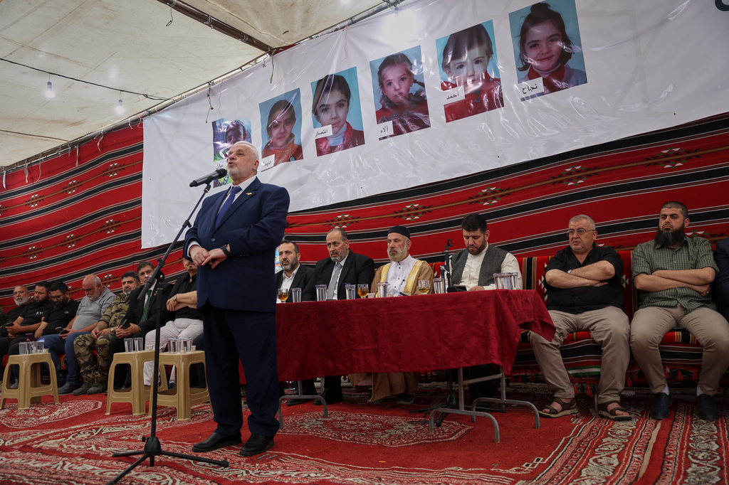 Mohammad Shukri, Syrian minister of religious affairs, speaks during a gathering to mourn former chess champion Rania al-Abbasi and her family, who disappeared 13 years ago, after relatives announced Monday they had evidence the family was killed by pro-government gunmen in 2013, in Damascus, Syria, Tuesday, June 2, 2026. (AP Photo/Ghaith Alsayed)