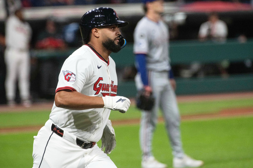 Cleveland Guardians' Johnathan Rodriguez, foreground, rounds the bases after hitting a two-run home run off Texas Rangers starting pitcher Jacob Latz during the first inning of a baseball game Saturday, Sept. 27, 2025, in Cleveland. (AP Photo/Phil Long) Cleveland Guardians' Johnathan Rodriguez, foreground, rounds the bases after hitting a two-run home run off Texas Rangers starting pitcher Jacob Latz during the first inning of a baseball game Saturday, Sept. 27, 2025, in Cleveland. (AP Photo/Phil Long)