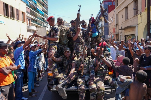 Soldiers are greeted by people gathering for a ceremony in tribute to demonstrators killed during recent anti-government protest in Antananarivo, Madagascar, Sunday, Oct. 12, 2025. (AP Photo/Mamyrael) Soldiers are greeted by people gathering for a ceremony in tribute to demonstrators killed during recent anti-government protest in Antananarivo, Madagascar, Sunday, Oct. 12, 2025. (AP Photo/Mamyrael)