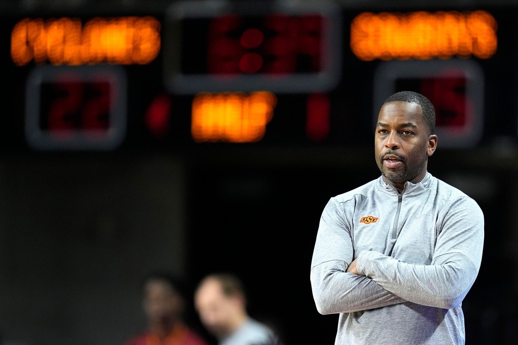 FILE - Oklahoma State head coach Mike Boynton watches from the bench during the first half of an NCAA college basketball game against Iowa State, Jan. 13, 2024, in Ames, Iowa. (AP Photo/Charlie Neibergall, File)