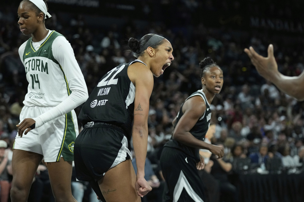Las Vegas Aces center A'ja Wilson (22) celebrates after a play against the Seattle Storm during the second half of Game 3 in the first round of the WNBA basketball playoffs Thursday, Sept. 18, 2025, in Las Vegas. (AP Photo/John Locher)