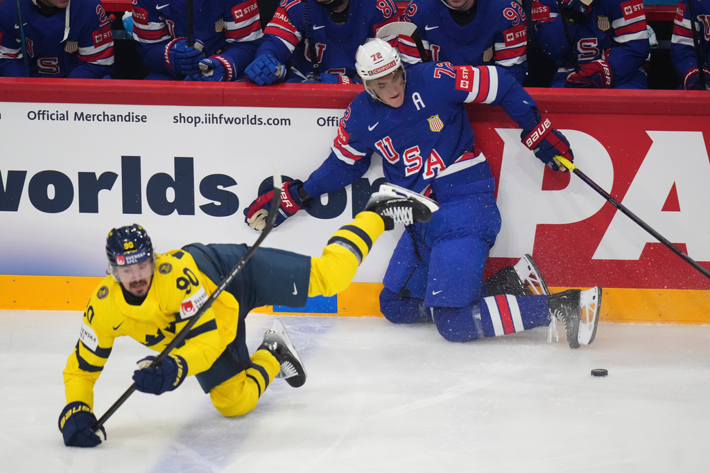FILE - Sweden's Marcus Johansson falls by United States' Tage Thompson during the semifinal match between Sweden and the United States at the ice hockey world championships in Stockholm,Sweden, Saturday, May 24, 2025. (AP Photo/Petr David Josek, File)