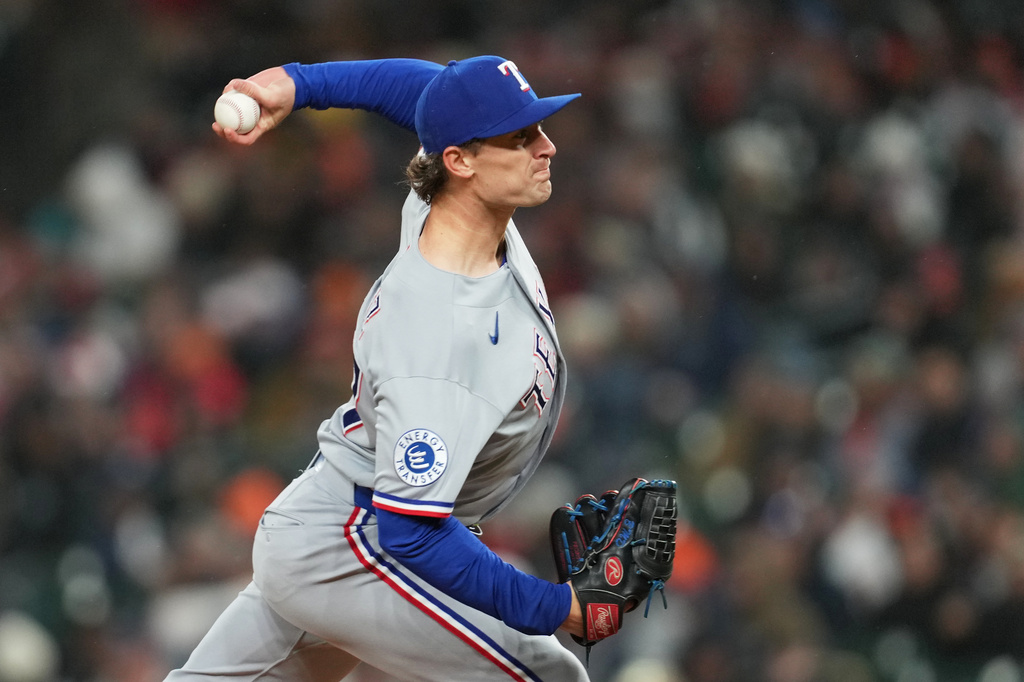 Texas Rangers pitcher Jacob Latz throws against the Detroit Tigers during the ninth inning of a baseball game Friday, May 1, 2026, in Detroit. (AP Photo/Paul Sancya)