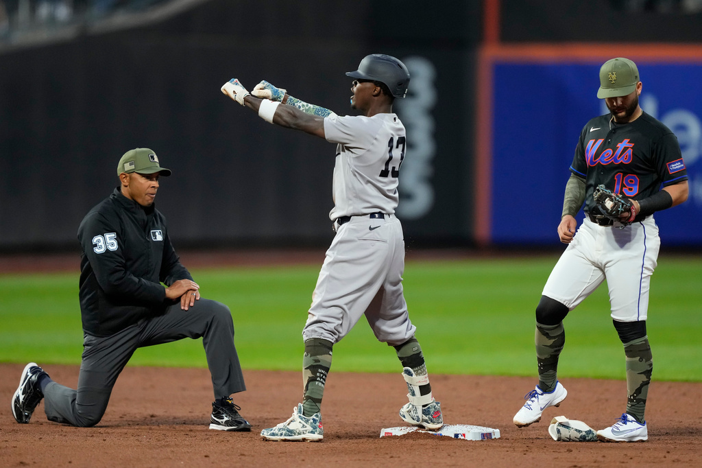 New York Yankees' Jazz Chisholm Jr., center, reacts after hitting an RBI double during the third inning of a baseball game against the New York Mets, Friday, May 15, 2026, in New York. (AP Photo/Yuki Iwamura)