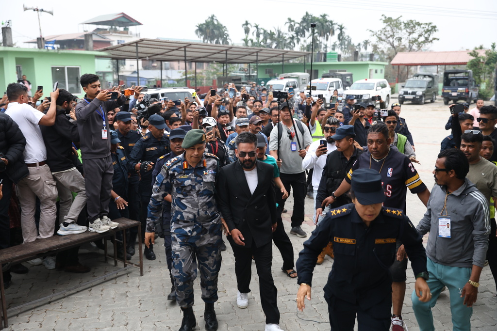 Balendra Shah, foreground, former mayor of Kathmandu Metropolitan City and prime ministerial candidate of the Rastriya Swatantra Party, arrives to receive his victory certificate after defeating former Prime Minister Khadga Prasad Oli of the Communist Party of Nepal–Unified Marxist-Leninist (CPN-UML) in Jhapa, about 267 miles (430 kilometers) southeast of Kathmandu, Nepal, Sunday, March 8, 2026. (AP Photo/Umesh Karki)