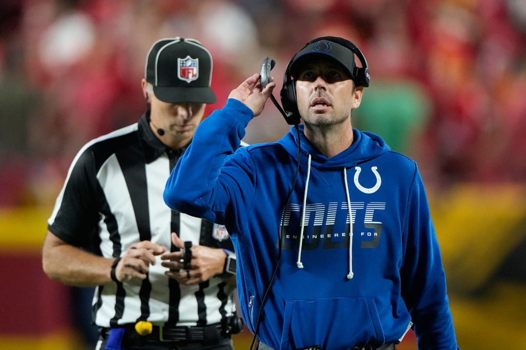 Indianapolis Colts head coach Shane Steichen looks at a replay during a review during overtime of an NFL football game against the Kansas City Chiefs Sunday, Sept. 20, 2026, in Kansas City, Mo. (AP Photo/Charlie Riedel)
