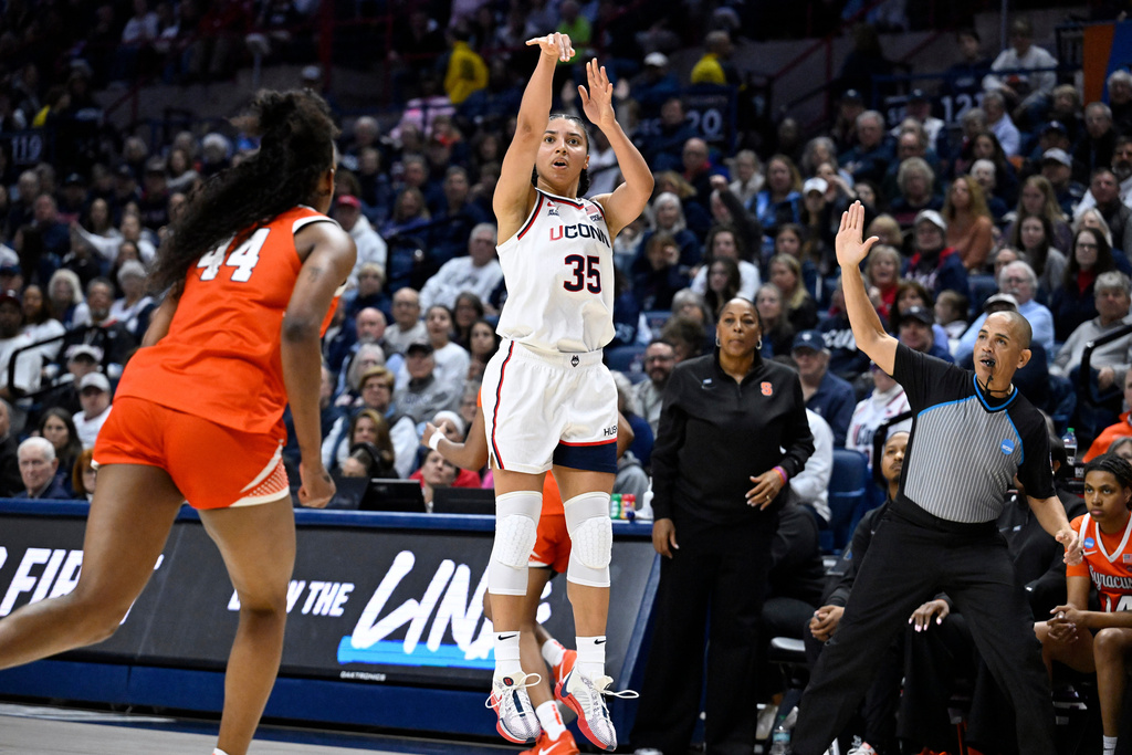 UConn guard Azzi Fudd (35) shoots a 3-point basket against Syracuse during the first half in the second round of the NCAA college basketball tournament, Monday, March 23, 2026, in Storrs, Conn. (AP Photo/Jessica Hill)