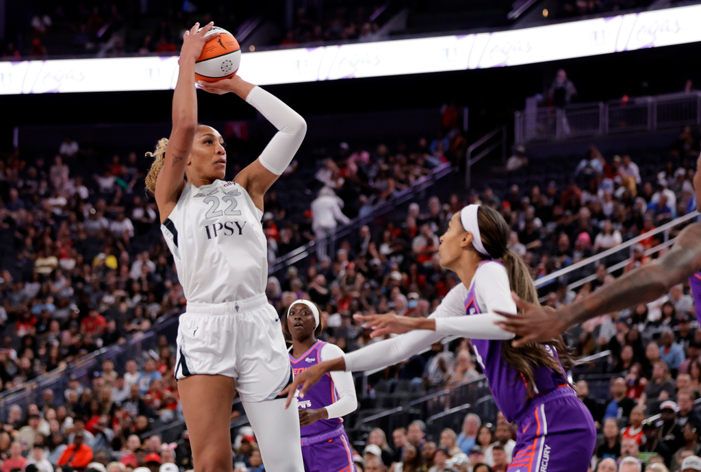 Las Vegas Aces center A'ja Wilson (22) looks to shoot over Phoenix Mercury forward/guard DeWanna Bonner, right, during the first half of an WNBA basketball game Saturday, May 9, 2026, in Las Vegas. (Steve Marcus/Las Vegas Sun via AP)