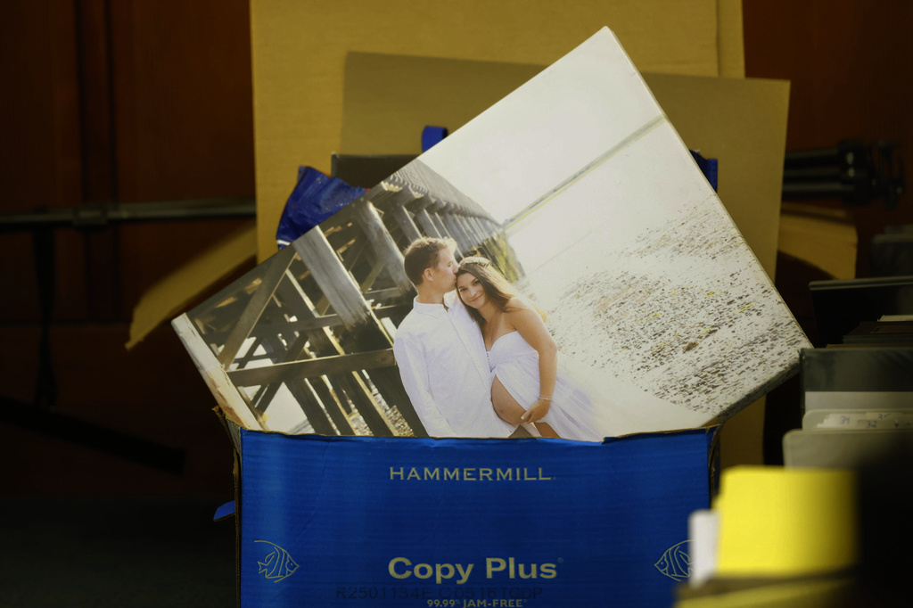 A wedding photo is seen in a bin of papers during the murder trial for Lindsay Clancy at Plymouth Superior Court in Plymouth, Mass., on Thursday, July 30, 2026. (CJ Gunther/The Boston Herald via AP, Pool)