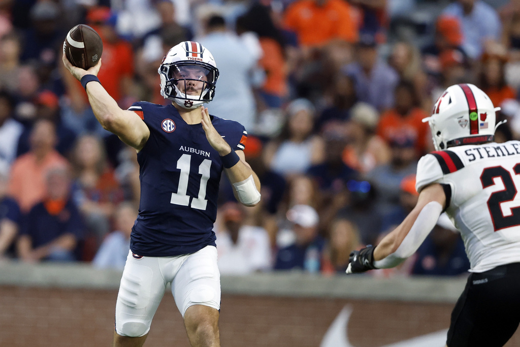 Auburn quarterback Jackson Arnold (11) throws a pass during the first half of an NCAA college football game against Ball State, Saturday, Sept. 6, 2025, in Auburn, Ala. (AP Photo/Butch Dill)