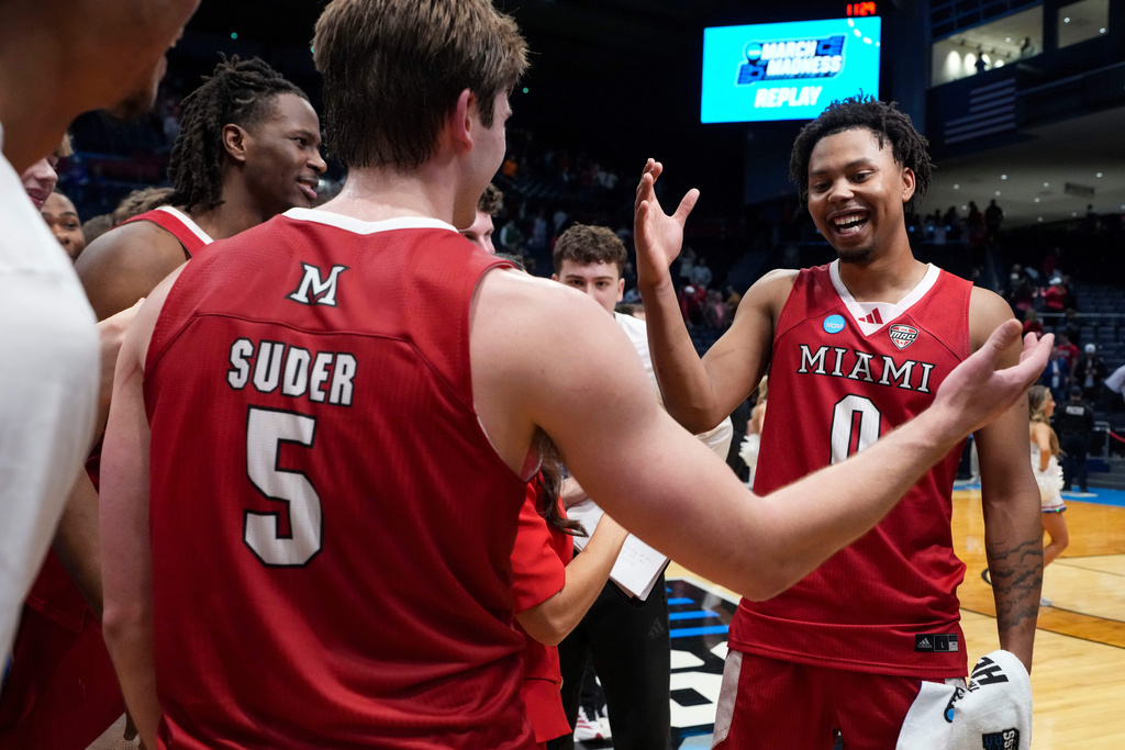 Miami (Ohio) guard Peter Suder (5) celebrates with teammate Eian Elmer (0) following a First Four college basketball game against SMU in the NCAA Tournament in Dayton, Ohio, Wednesday, March 18, 2026. (AP Photo/Jeff Dean)