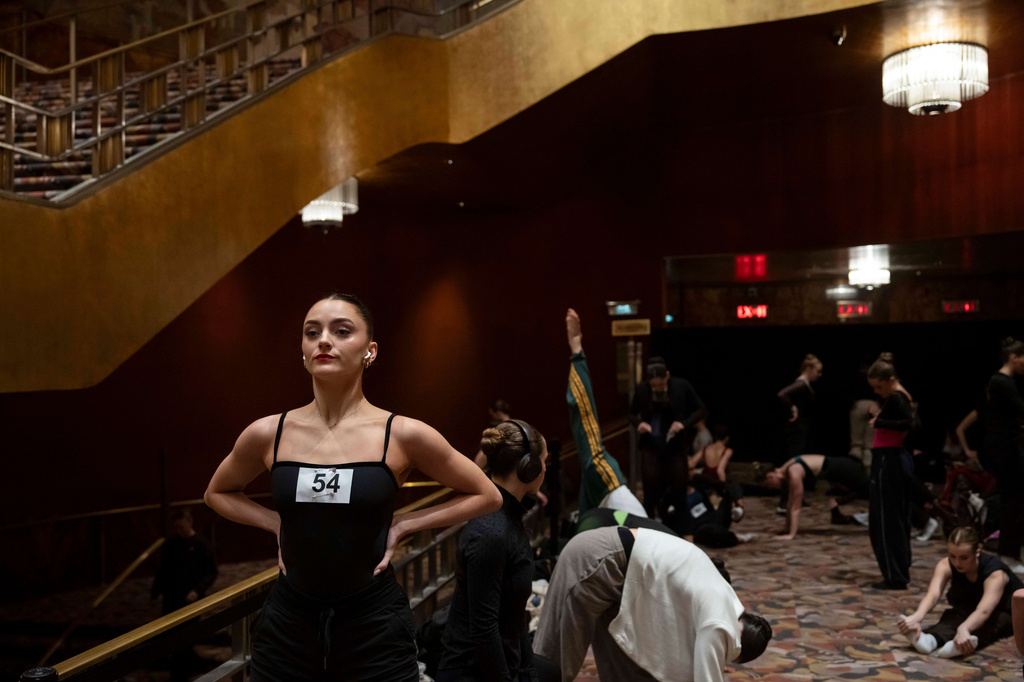 Dancers warm up and stretch before an audition for the Radio City Rockettes at Radio City Music Hall in New York, on Wednesday, April 22, 2026. (AP Photo/Yuki Iwamura)