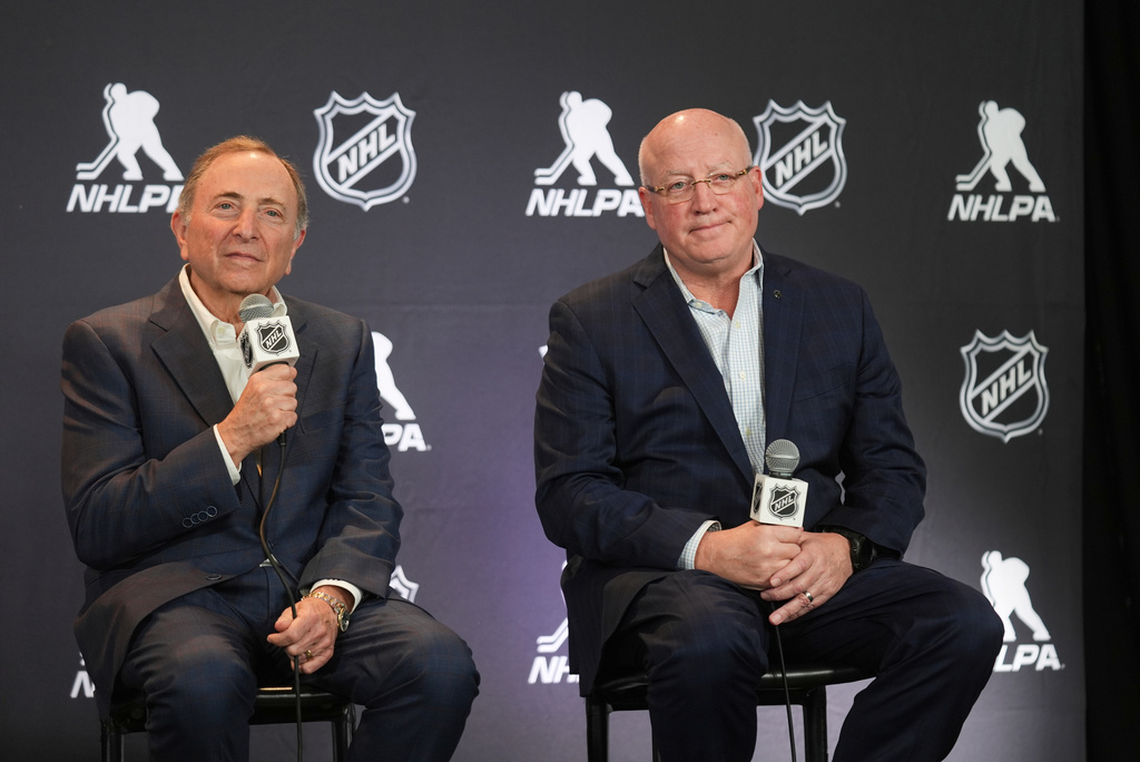 FILE - NHL Commissioner Gary Bettman, left, and Bill Daly, NHL Deputy Commissioner, conduct a joint news conference before the NHL hockey draft on June 27, 2025, in Los Angeles. (AP Photo/Damian Dovarganes, File)