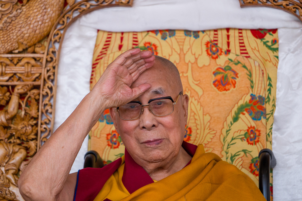 Tibetan spiritual leader the Dalai Lama greets devotees during his birthday celebrations in Leh, India, Monday, July 6, 2026. (AP Photo/Tenzin Choejor)