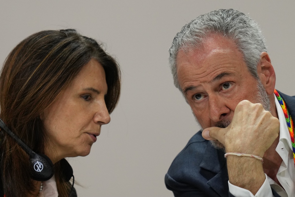 André Corrêa do Lago, COP30 president, right, and Ana Toni, COP30 CEO, talk at a news conference during the COP30 U.N. Climate Summit, Tuesday, Nov. 18, 2025, in Belem, Brazil. (AP Photo/Andre Penner)