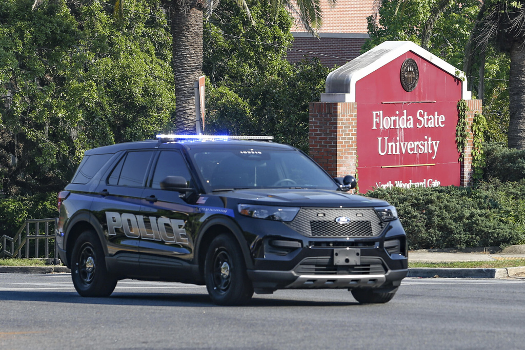 FILE - The Florida State Student Union building is seen behind law enforcement vehicles in Tallahassee, Fla., April 17, 2025. (AP Photo/Gary McCullough, File)