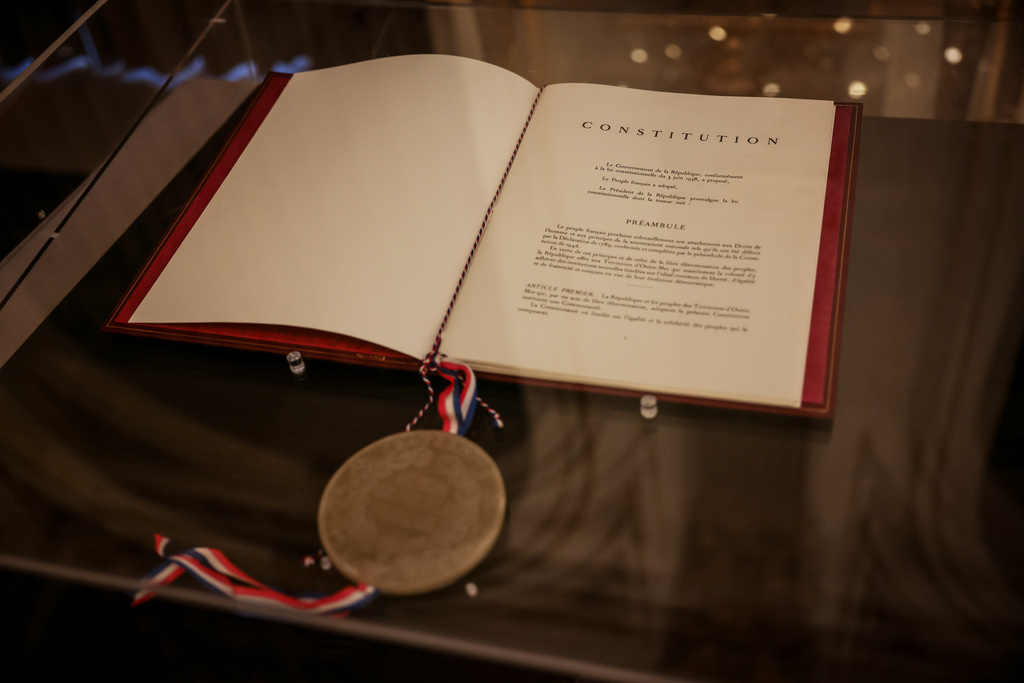The text of the French Constitution is on display at the Elysee Palace in Paris on Saturday, Sept. 19, 2026. (AP Photo/Thomas Padilla)