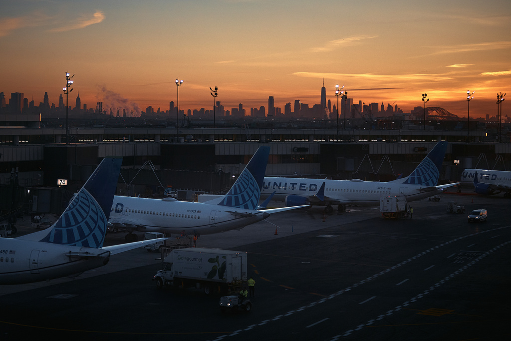Planes are seen at Newark Liberty International Airport on Friday, Nov. 7, 2025, in Newark, N.J. (AP Photo/Andres Kudacki)
