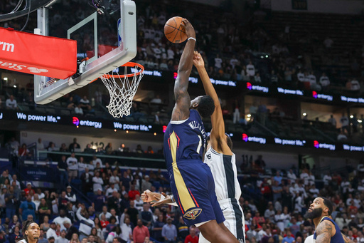 New Orleans Pelicans forward Zion Williamson (1) dunks against San Antonio Spurs forward Victor Wembanyama (1) during the first half of an NBA basketball game Friday, Oct. 24, 2025, in New Orleans. (AP Photo/Peter Forest) New Orleans Pelicans forward Zion Williamson (1) dunks against San Antonio Spurs forward Victor Wembanyama (1) during the first half of an NBA basketball game Friday, Oct. 24, 2025, in New Orleans. (AP Photo/Peter Forest)
