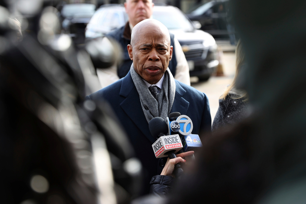 FILE - NYC Mayor Eric Adams speaks to the press after the arrival of Luigi Mangione, a suspect in the fatal shooting of UnitedHealthcare CEO Brian Thompson, Dec. 19, 2024, in New York. (AP Photo/Pamela Smith, File)