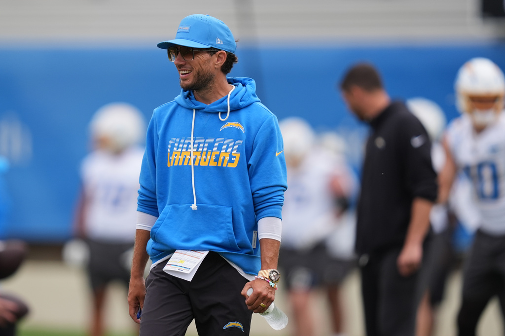 Los Angeles Chargers offensive coordinator Mike McDaniel smiles during an NFL football training camp Wednesday, Aug. 5, 2026, in San Diego. (AP Photo/Gregory Bull)