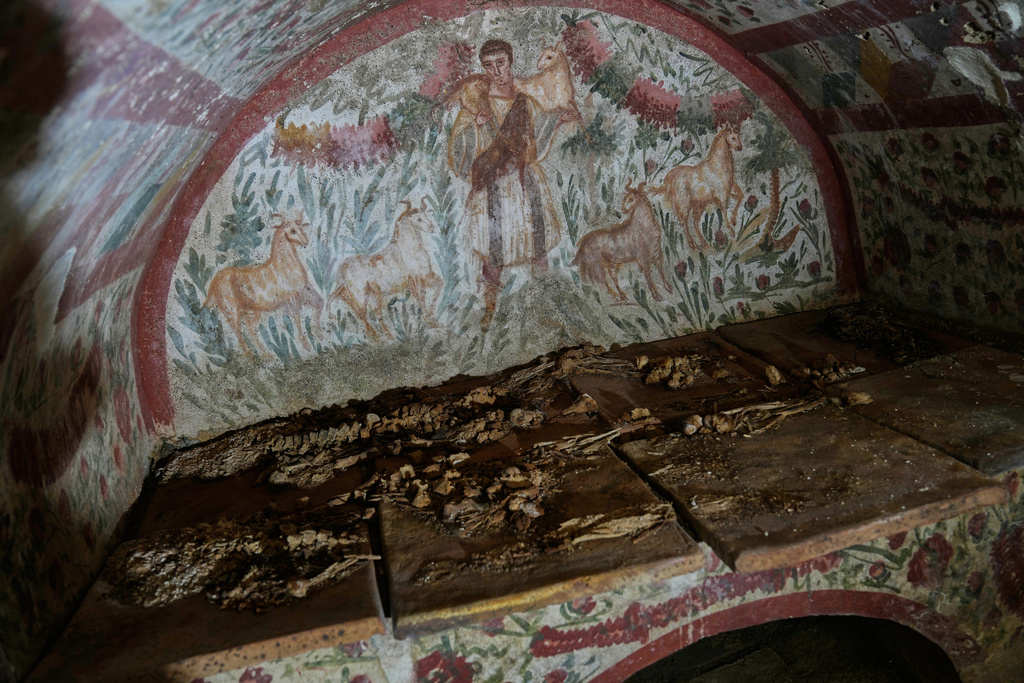 A fresco depicting Jesus as the "Good Shepherd" adorns the wall of a 3rd-century tomb in Hisardere, where archaeologists uncovered one of Anatolia's best-preserved early Christian artworks, in Iznik, Turkey, Friday, Dec. 12, 2025. (AP Photo/Khalil Hamra)