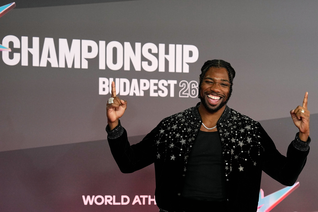 Sprinter Noah Lyles, of the United States, poses on the red carpet for the formal opening of the World Athletics Ultimate Championship in Budapest, Hungary, Thursday, Sept. 10, 2026. (AP Photo/Matthias Schrader)