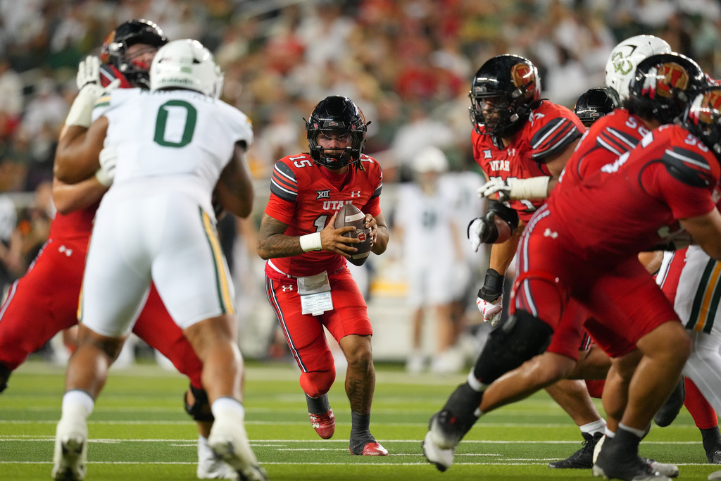 Utah quarterback Byrd Ficklin runs a play against Baylor during the second half of an NCAA college football game Saturday, Nov. 15, 2025, in Waco, Texas. (AP Photo/Julio Cortez)
