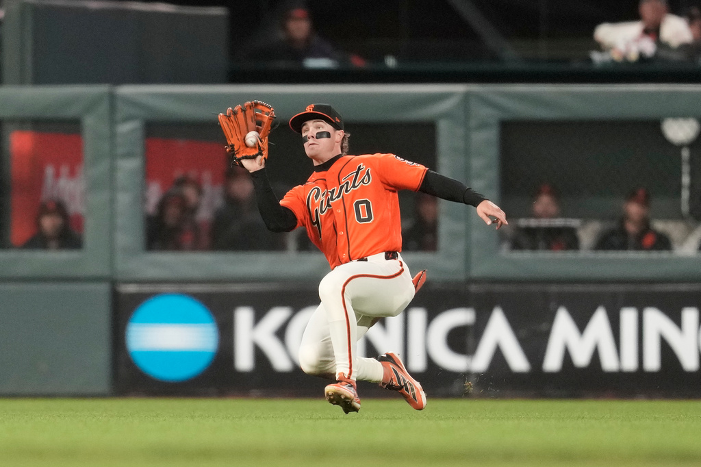 San Francisco Giants center fielder Drew Gilbert catches a fly out hit by Colorado Rockies' Mickey Moniak during the fifth inning of a baseball game, Friday, July 10, 2026, in San Francisco. (AP Photo/Jeff Chiu)