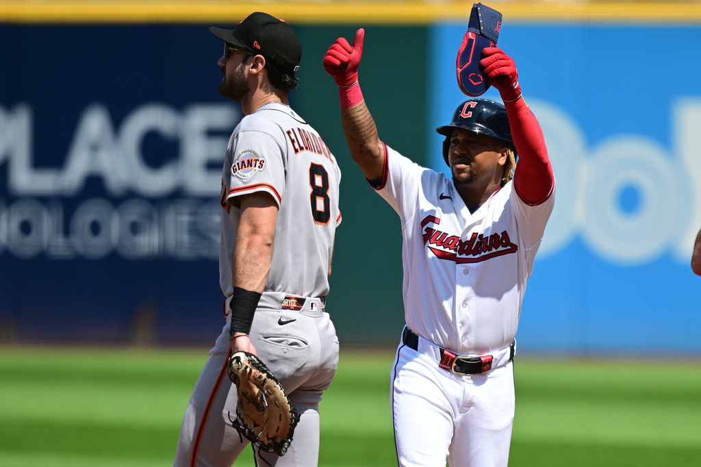 Cleveland Guardians' Jose Ramirez celebrates after hitting an RBI single during the first inning of a baseball game against the San Francisco Giants, Thursday, Aug. 20, 2026, in Cleveland. (AP Photo/David Dermer)