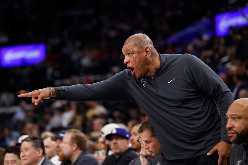Milwaukee Bucks head coach Doc Rivers yells out to players on the court during the first half of an NBA basketball game against the LA Clippers, Monday, March 23, 2026, in Inglewood, Calif. (AP Photo/Caroline Brehman)