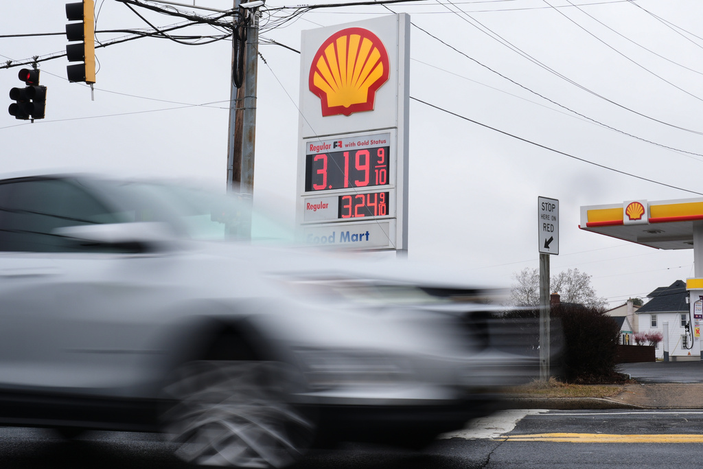 Fuel prices are displayed at a gas station as cars drive by, Wednesday, March 4, 2026, in Baltimore. (AP Photo/Stephanie Scarbrough)