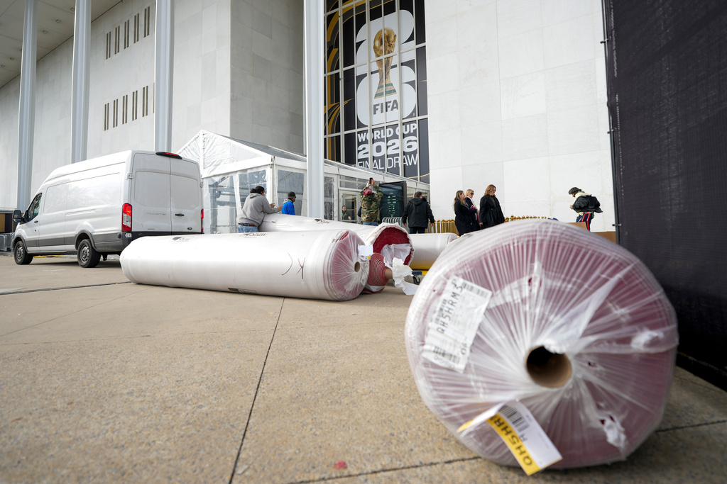 The red carpet is delivered prior to the final draw for the 2026 soccer World Cup at the Kennedy Center in Washington, Thursday, Dec. 4, 2025. (AP Photo/Chris Carlson)