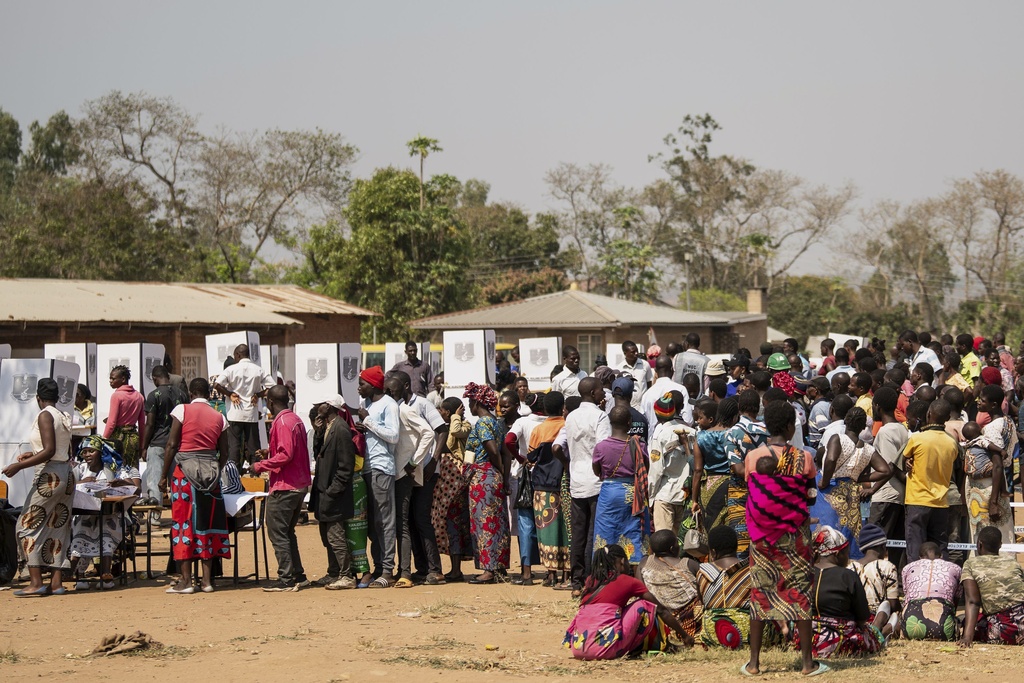 People line up to cast their votes in Thyolo District, Malawi, Tuesday, Sept. 16, 2025. (AP Photo/Thoko Chikondi)