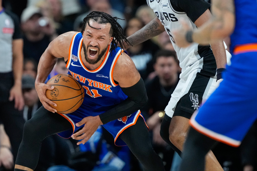New York Knicks guard Jalen Brunson is pressured during the first half of Game 5 of the NBA Finals basketball series against the San Antonio Spurs, Saturday, June 13, 2026, in San Antonio. (AP Photo/Ross D. Franklin)