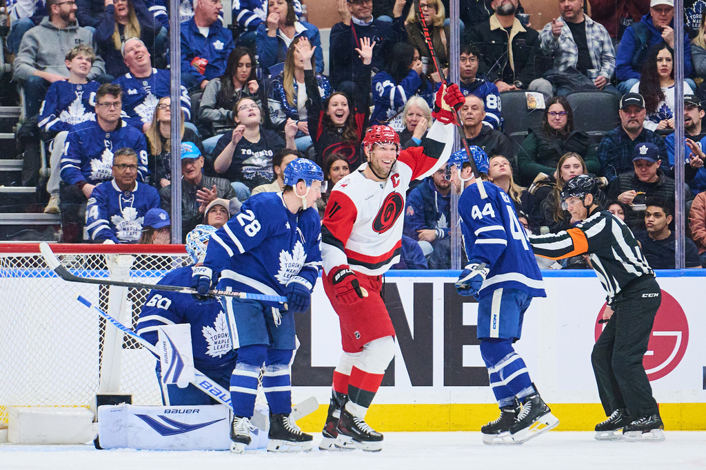 Carolina Hurricanes' Jordan Staal (11) celebrates after scoring against the Toronto Maple Leafs during second-period NHL hockey game action in Toronto, Friday, March 20, 2026. (Sammy Kogan/The Canadian Press via AP)
