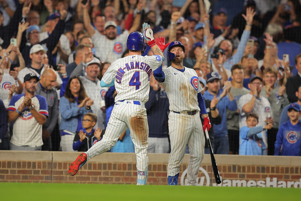 Chicago Cubs' Pete Crow-Armstrong, left, celebrates his home run with teammate Michael Busch, right, during the seventh inning of a baseball game against the Atlanta Braves, Wednesday, Sept. 16, 2026, in Chicago. (AP Photo/Melissa Tamez)