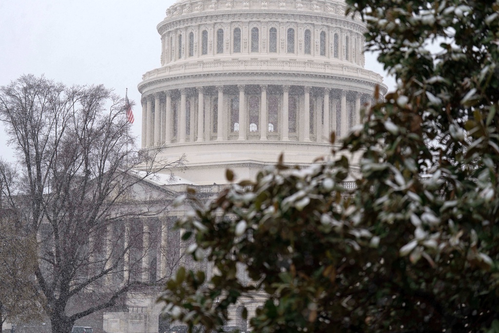 The U.S. Capitol is seen during a snowy day on Capitol Hill Thursday, March 12, 2026, in Washington. (AP Photo/Jose Luis Magana)
