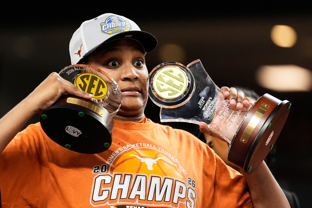 Texas forward Madison Booker celebrates after their win against South Carolina in an NCAA college basketball game in the final of the Southeastern Conference tournament, Sunday, March 8, 2026, in Greenville, S.C. (AP Photo/Chris Carlson)
