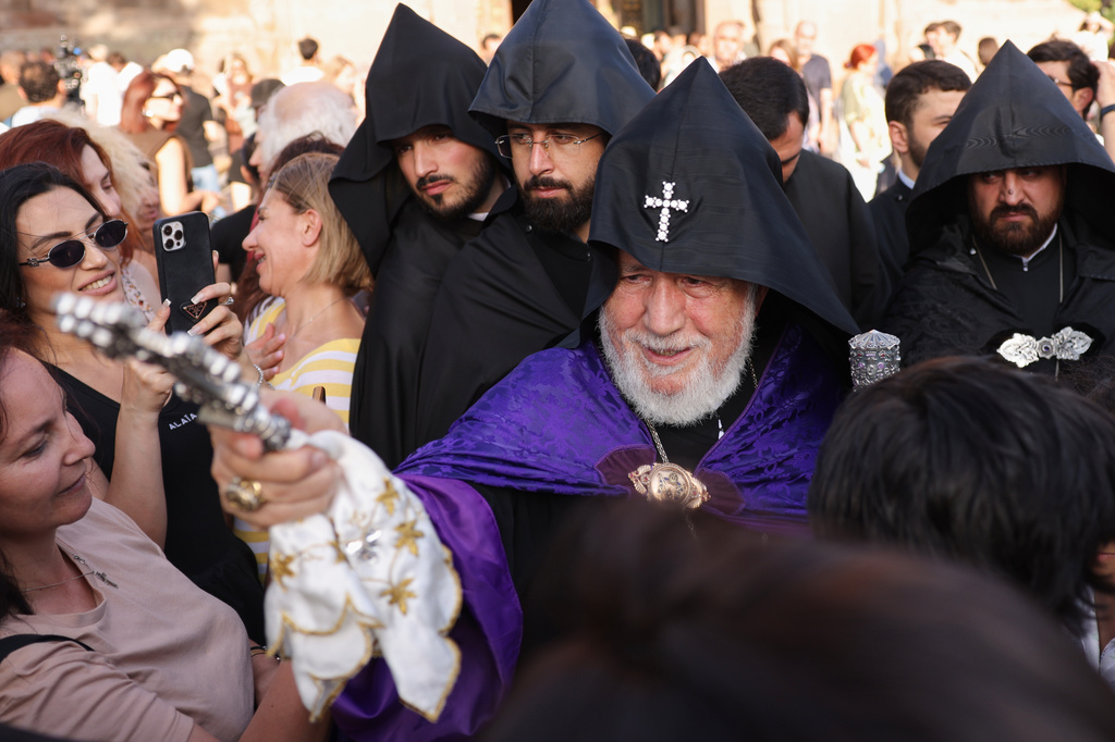 The head of the Armenian Apostolic Church Catholicos Karekin II, center, blesses people in Vagharshapat, Armenia, Friday, Aug. 7, 2026. (AP Photo/Anthony Pizzoferrato)