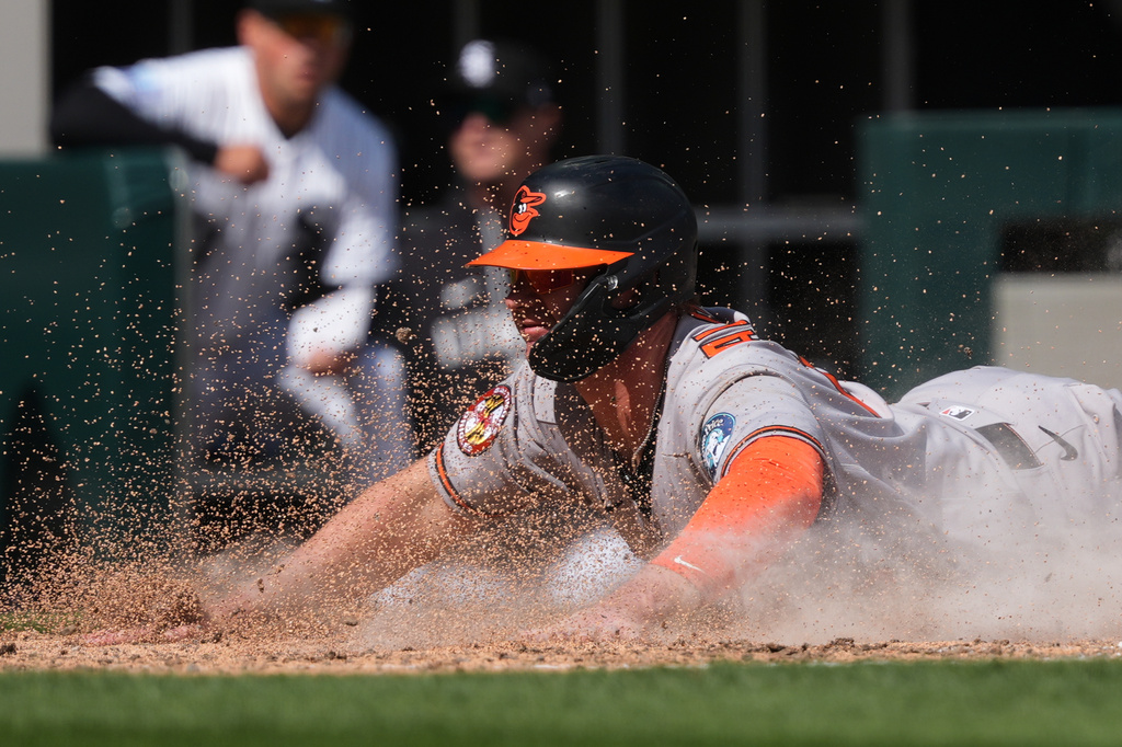 Baltimore Orioles' Pete Alonso scores on a passed ball by Chicago White Sox catcher Reese McGuire during the sixth inning of a baseball game in Chicago, Wednesday, April 8, 2026. (AP Photo/Nam Y. Huh)
