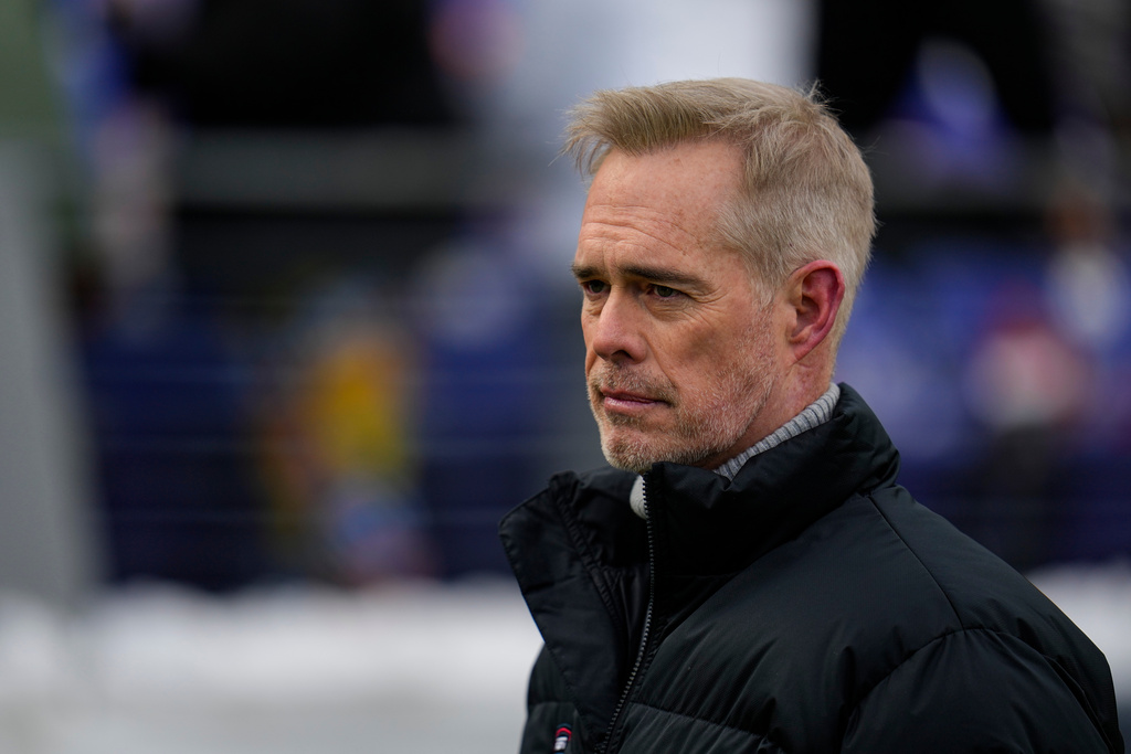 FILE - ESPN broadcaster Joe Buck walks the field before an NFL football AFC divisional playoff game between the Baltimore Ravens and the Houston Texans, Jan. 20, 2024, in Baltimore. (AP Photo/Julio Cortez, File)
