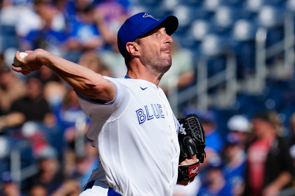 Toronto Blue Jays pitcher Max Scherzer throws against the Cincinnati Reds during the first inning of a baseball game in Toronto, Sunday, Sept. 27, 2026. (Frank Gunn/The Canadian Press via AP)