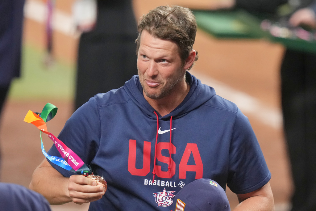 Former MLB player Clayton Kershaw carries a silver medal after the championship game of the World Baseball Classic against Venezuela, Tuesday, March 17, 2026, in Miami. (AP Photo/Lynne Sladky)