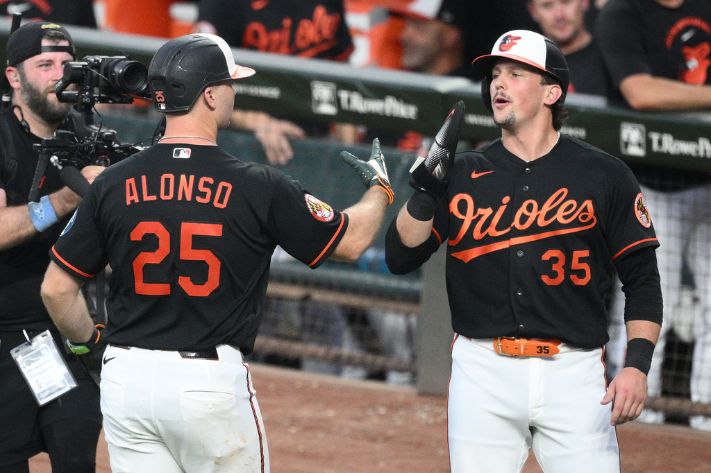 Baltimore Orioles' Pete Alonso (25) celebrates his two-run home run with Adley Rutschman (35) during the third inning of a baseball game against the Seattle Mariners, Thursday, June 11, 2026, in Baltimore. (AP Photo/Nick Wass)