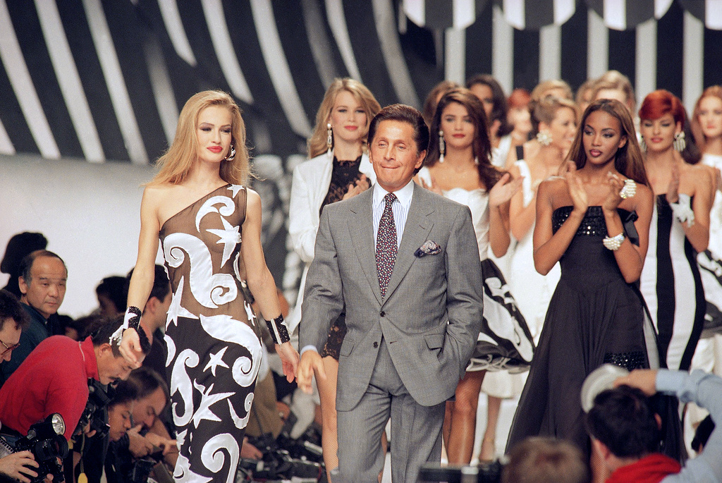 FILE - Italian fashion designer Valentino Garavani walks the catwalk with his models after a fashion show on October 20, 1991 in Paris, France. (AP Photo/Remy de la Mauviniere, File)