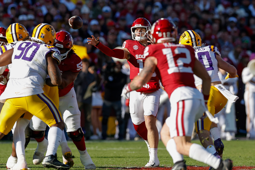Oklahoma quarterback John Mateer (10) passes against LSU during the first half of an NCAA college football game Saturday, Nov. 29, 2025, in Norman, Okla. (AP Photo/Alonzo Adams)