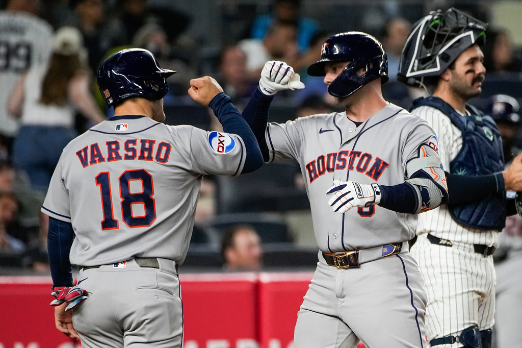 Houston Astros' Christian Walker, right, celebrates his two-run home run with teammate Daulton Varsho (18) during the sixth inning of a baseball game against the New York Yankees Thursday, Aug. 27, 2026, in New York. (AP Photo/Eduardo Munoz Alvarez)