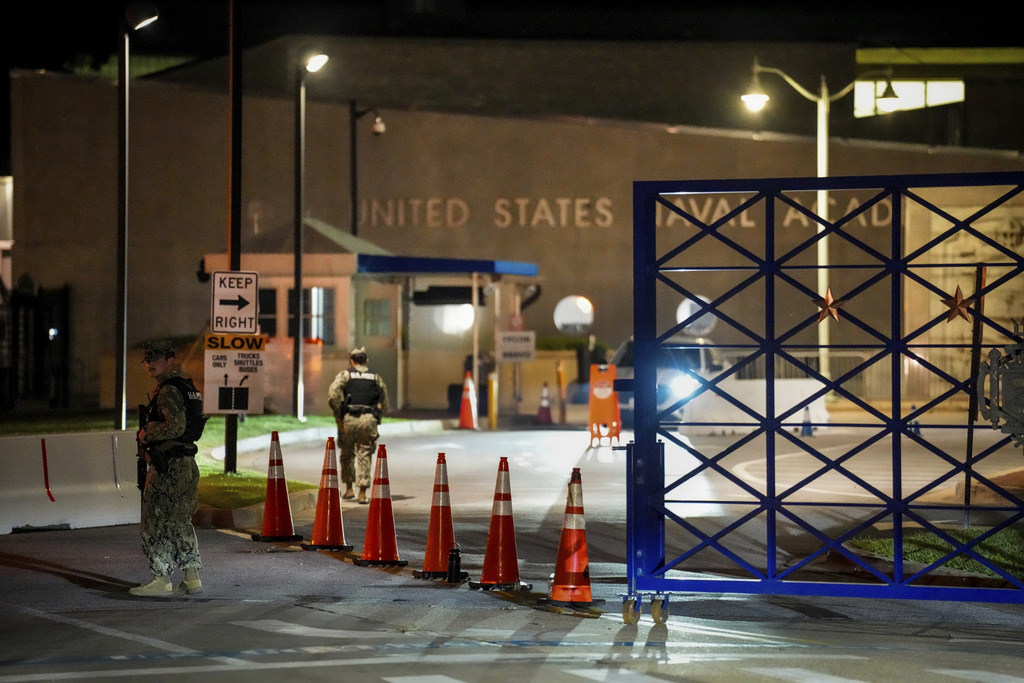 Response vehicles leave through the main gate of the Naval Academy, Thursday, Sept. 11, 2025, in Annapolis, Md. (Ulysses Muñoz/The Baltimore Banner)