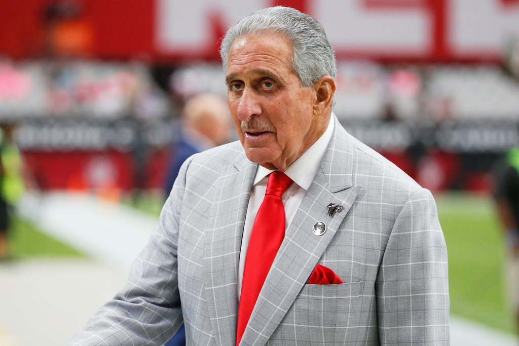FILE - Atlanta Falcons owner Arthur Blank stands on the field prior to an NFL football game against the Arizona Cardinals, Oct. 13, 2019, in Glendale, Ariz. (AP Photo/Rick Scuteri, File)